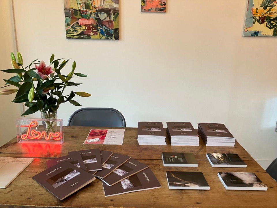 Copies of All About Love arranged on a table at the launch