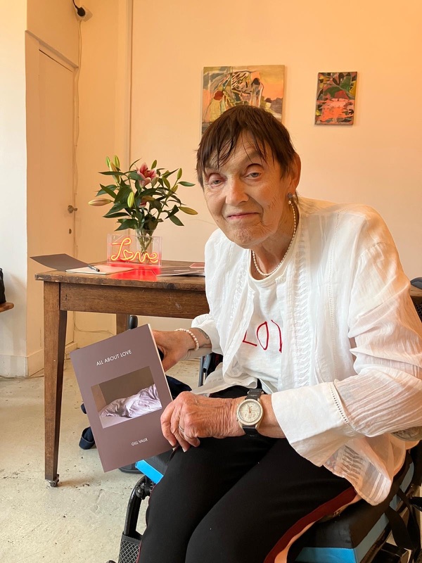 Gill Vaux holding her book, All About Love